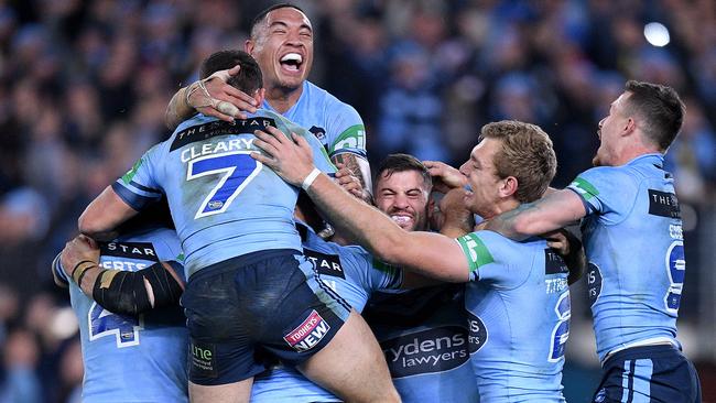 Blues players celebrate an Origin win. Picture: AAP/Dan Himbrechts