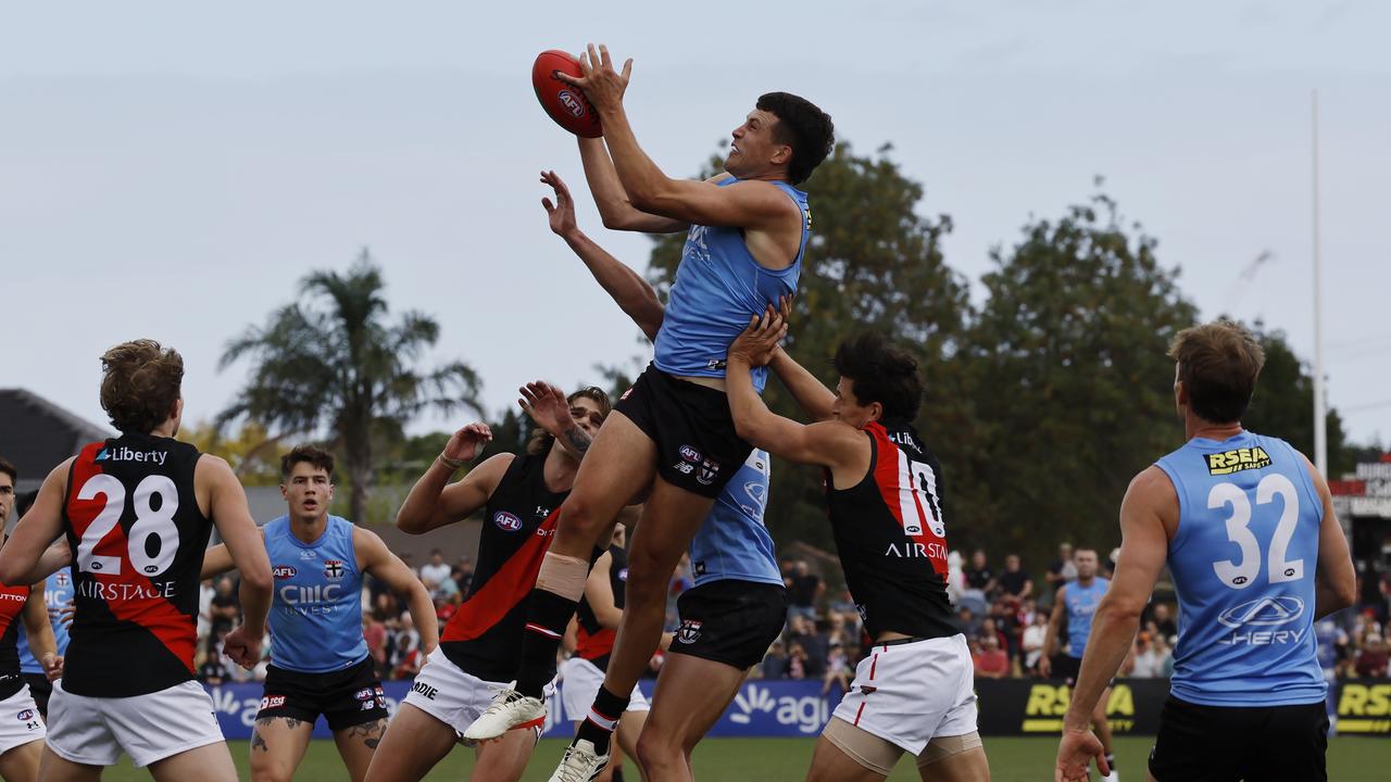 Rowan Marshall flies high above a pack of Saints and Bombers during the sides’ unofficial hit-out. Picture: Michael Klein