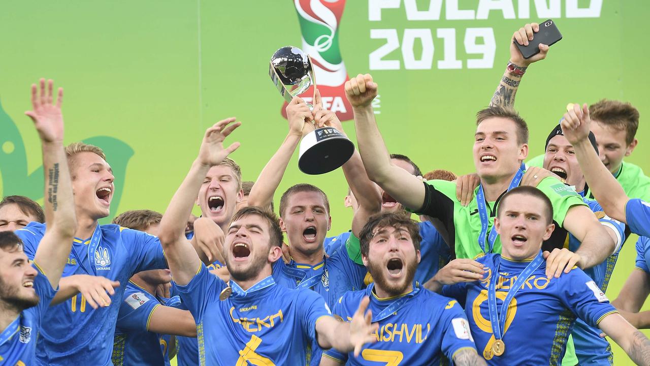Ukraine's players celebrate with their trophy after winning the U20 World Cup final