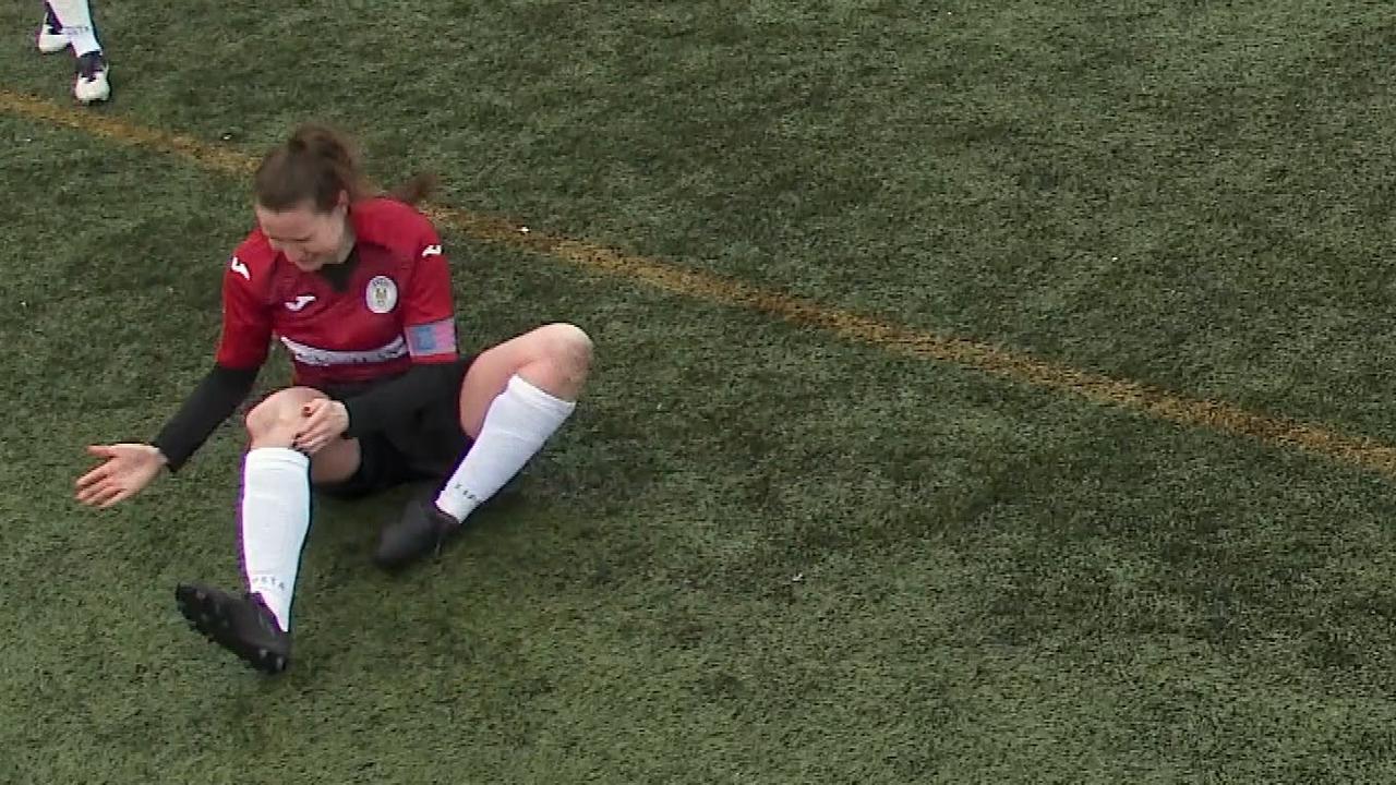 St Mirren captain Jane O'Toole banging her kneecap into place.