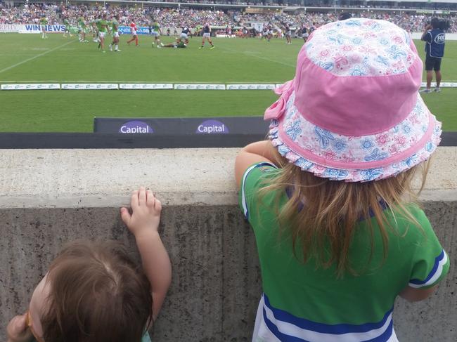 Cooper and Miley watching a home game at Canberra Stadium.