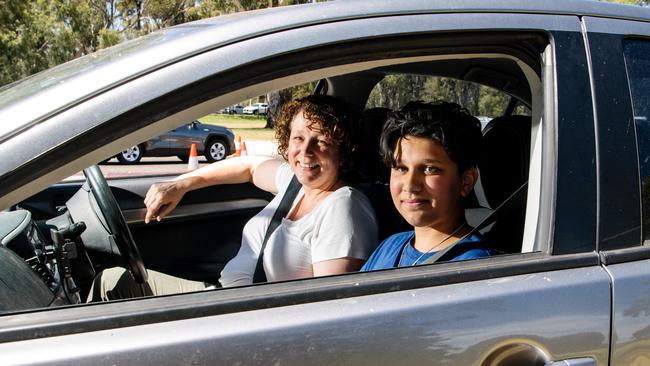 Carolyne and Liam DMello who started watching a movie on a laptop during their wait at Victoria Park. Picture: Morgan Sette