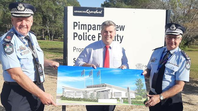 Assistant Commissioner Brian Wilkins, Police Minister Mark Ryan and Deputy Commissioner Doug Smith pose with the new design. Photo: Brianna Morris-Grant