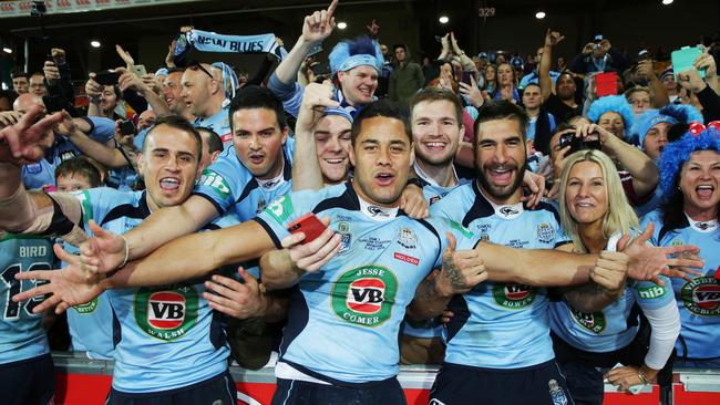NSW Josh Reynolds, Jarryd Hayne and James Tamou with fans after winning the Origin series in 2014.