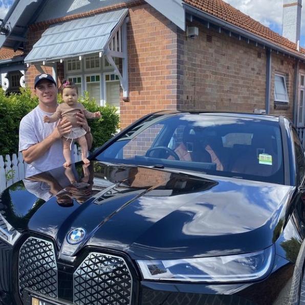 Eels playmaker Mitchell Moses with his pride and joy, his daughter Aspyn Ell, and his Beamer.