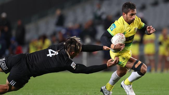 Maurice Longbottom gets past Trael Joass from the All Blacks Sevens.