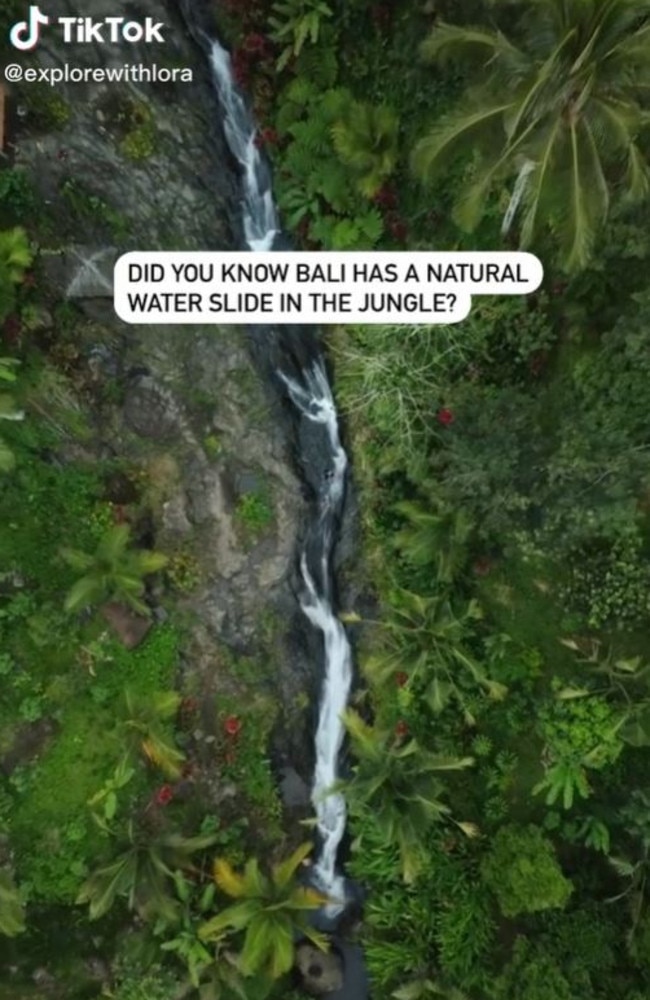 Hidden in the mountains in north Bali is a stunning waterfall with a ‘jungle waterslide’. Picture: TikTok/explorewithlora