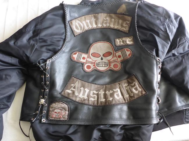 Outlaws leather bikie jacket seized in raids on bikie clubhouses across Tasmania