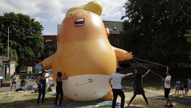 The ‘Baby Trump’ blimp is erected during a practice session in Bingfield Park, north London. Photo: AP