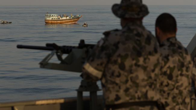 HMAS Arunta personnel keep watch during a boarding while on patrol in the Middle East. Picture: ADF