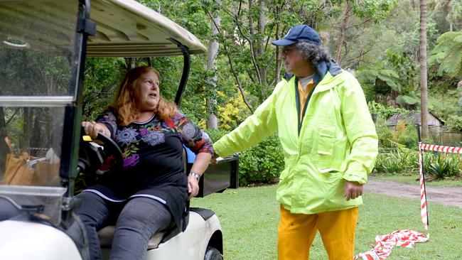 Neighbour and resident Suzie Haddock talks with Senior Deputy Captain of Mackerel Beach RFS Bob Mitchell as she is evacuated from the site after a landslide behind her home. Sydney, Monday, 26 October, 2020. Picture: NCA NewsWire / Jeremy Piper