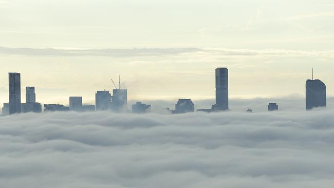 Fog over Brisbane’s CBD this morning. Picture: Mark Cranitch