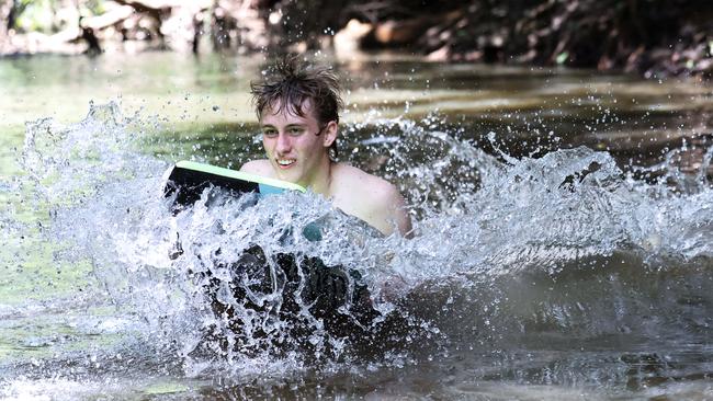 Cairns is currently experiencing hot and sticky weather typical of the start of summer. Smithfield teenager Riley Swan finds respite from the warm weather by taking a dip in the cool waters of Freshwater Creek. Picture: Brendan Radke