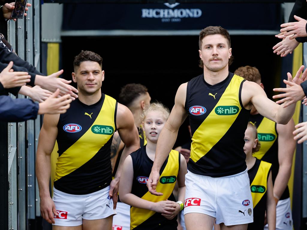 Liam Baker leads the Tigers onto the field in the absence of captain Toby Nankervis. Picture: Dylan Burns/AFL Photos via Getty Images.