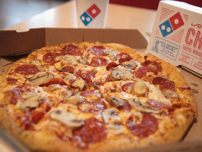 CHICAGO, IL - OCTOBER 12: Domino's menu items are shown on October 12, 2017 in Chicago, Illinois. Shares of the restaurant chain fell 4 percent today despite reporting an increase of more than 8 percent in domestic same-store sales. (Photo Illustration by Scott Olson/Getty Images) == FOR NEWSPAPERS, INTERNET, TELCOS & TELEVISION USE ONLY ==