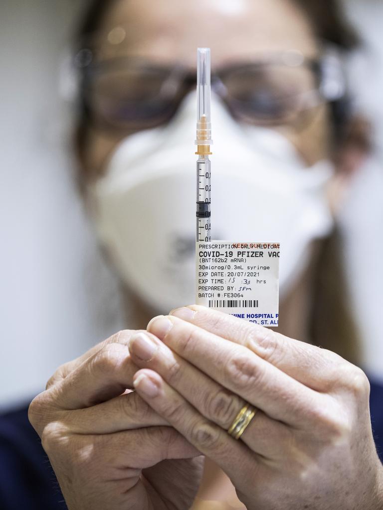 Staff preparing a Pfizer vaccine dose. Picture: Daniel Pockett/Getty