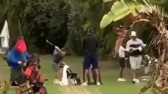 Tiger Woods seen caddying for his 10-year-old son