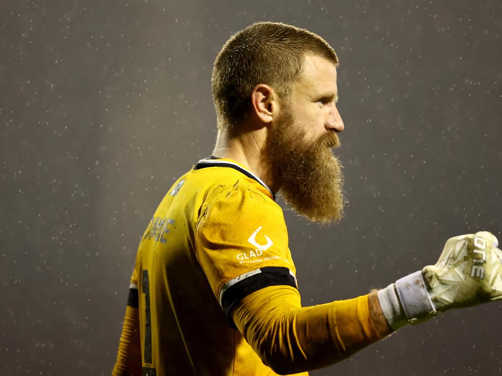 Sydney FC keeper Andrew Redmayne celebrates making a save in his side’s penalty-shootout Australia Cup win over Central Coast. Picture: Jeremy Ng/Getty Images