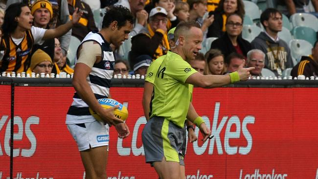 Umpire Ray Chamberlain awards a deliberate rushed behind free kick against Hawthorn. Picture: Wayne Ludbey