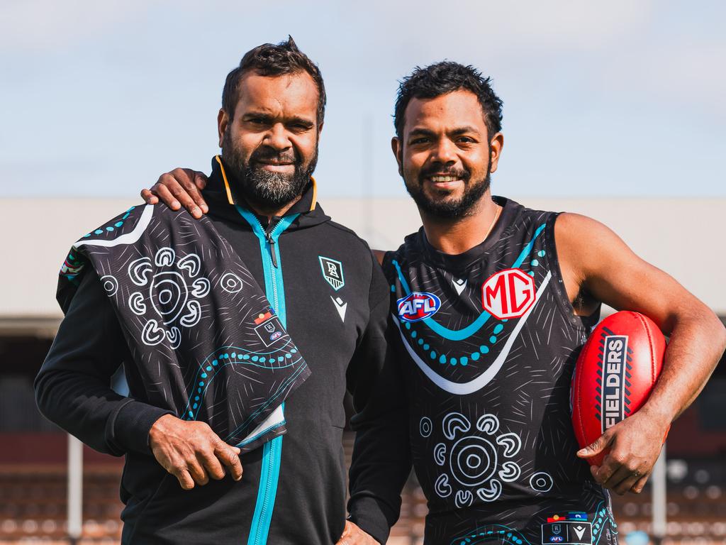 Byron Pickett and Willie Rioli with Port Adelaide's 2024 Indigenous guernsey for Sir Doug Nicholls Round. Picture: Matt Sampson