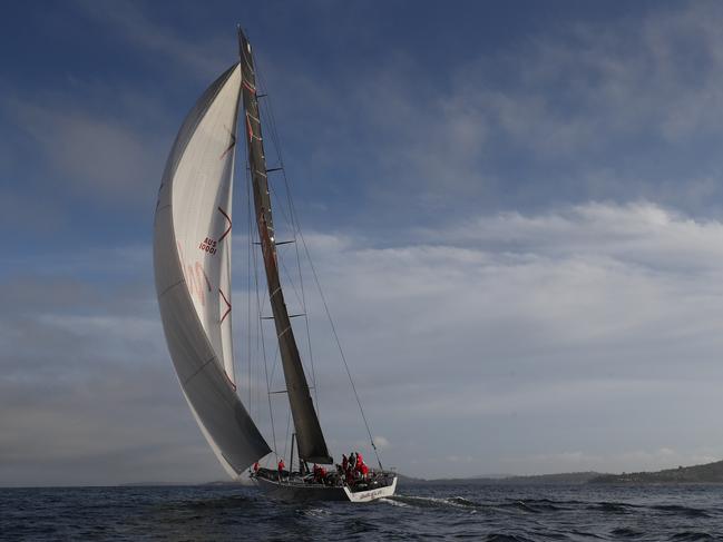 Race-winner Wild Oats XI sails towards the finish line. Picture: AAP/ROB BLAKERS