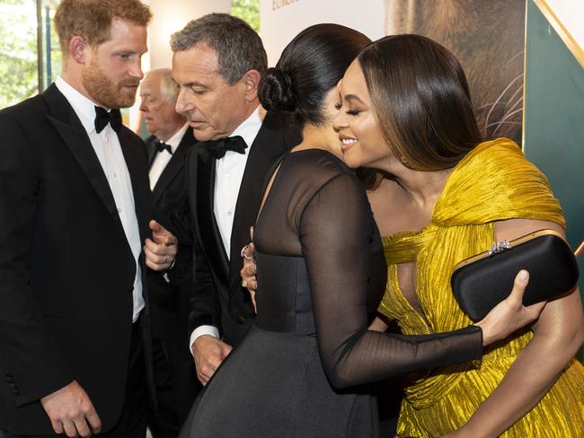 Prince Harry (L) chats with Disney CEO Robert Iger as Meghan, Duchess of Sussex (2nd R) embraces Beyonce Knowles-Carter (R) at the European Premiere of Disney's "The Lion King". Picture: Getty Images