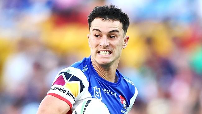 BRISBANE, AUSTRALIA - MAY 18: David Armstrong of the Knights breaks a way to score a try during the round 11 NRL match between Gold Coast Titans and Newcastle Knights at Suncorp Stadium, on May 18, 2024, in Brisbane, Australia. (Photo by Chris Hyde/Chris Hyde)