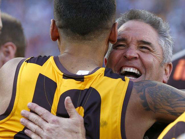 Fagan gives Bradley Hill a hug after the 2014 Grand Final. Picture: Wayne Ludbey
