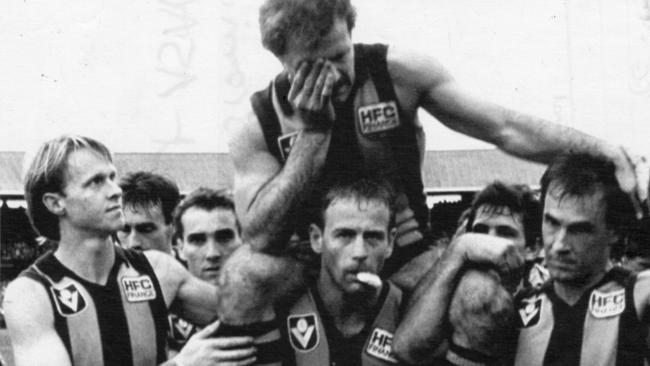 A teary Leigh Matthews being chaired off the ground after his final game for Hawthorn in 1985.