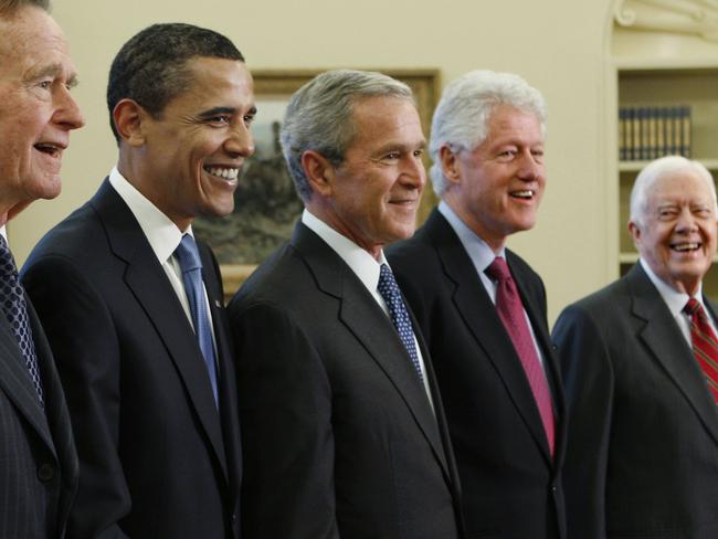 In file photo, George W. Bush, centre, poses Barack Obama, and former presidents, from left, George H.W. Bush, left, Bill Clinton and Jimmy Carter, right, in the Oval Office. Picture: AP.