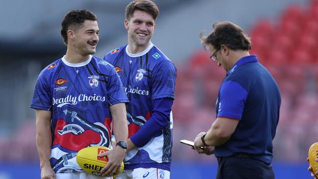 Riley Garcia (left) with teammate Bailey Williams and coach Luke Beveridge. Picture: Jason McCawley/AFL Photos/via Getty Images