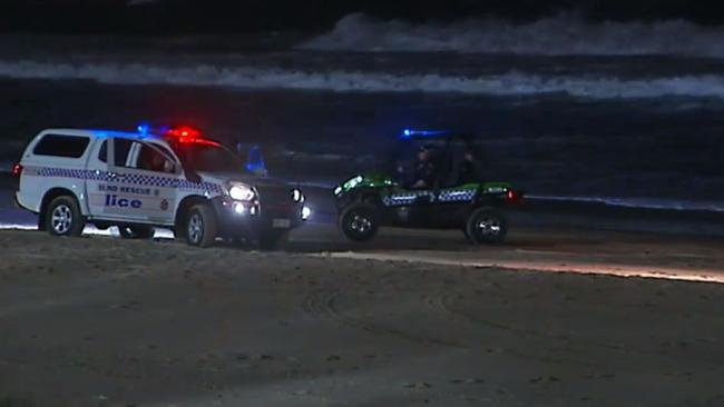 Police on Surfers Paradise beach after the infant’s body washed up.