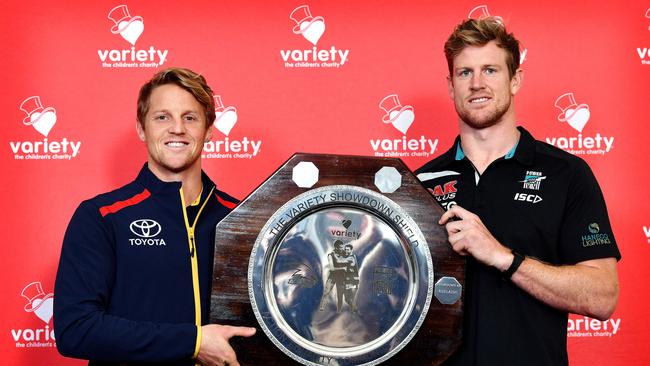 Adelaide co-captain Rory Sloane, left, with Port’s co-captain Tom Jonas ahead of Showdown 47.