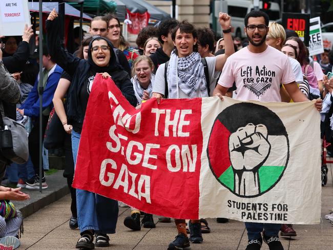 BRISBANE, AUSTRALIA - OCTOBER 13, 2024: Protestors gathered in central Brisbane for the All Out For Palestine 12 month anniversary of Israel's response to October 7 Hamas attack and kidnapping of israeli citizens. Picture: Tertius Pickard