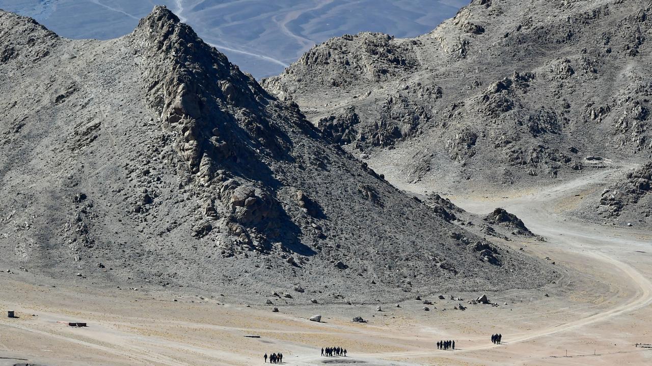 Indian soldiers walk at the foothills of a mountain range near Leh, the joint capital of the union territory of Ladakh. Picture: Tauseef Mustafa/AFP