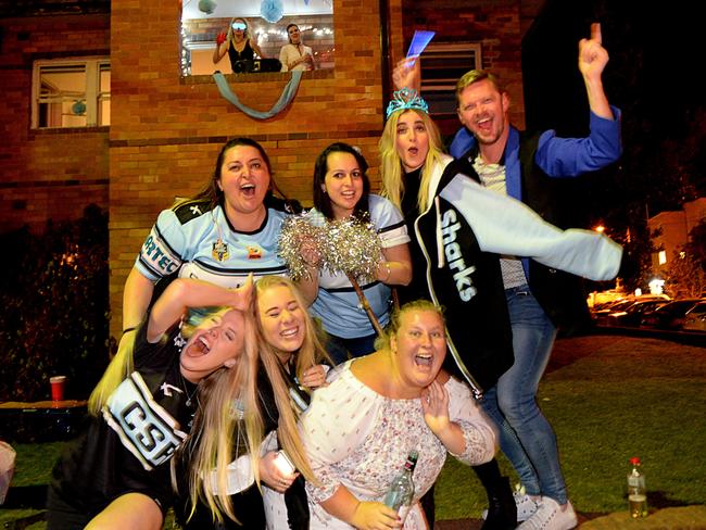 All night party... Fans get into the spirit outside thier Cronulla unit block. Picture: Jeremy Piper