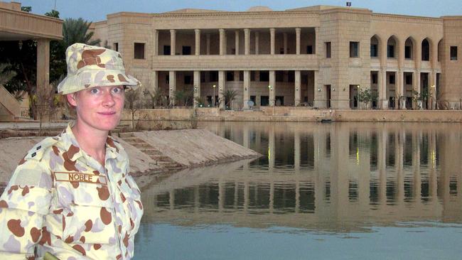 Australian Army officer Lieutenant Kate Noble in front of Saddam Hussein’s abandoned palace in Camp Victory in Baghdad, Iraq, in 2003. Picture: Paul Starick