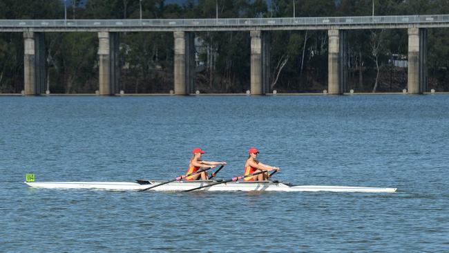A pair of Stuartholme School rowers head out on to the course during the Queensland Secondary Schools Rowing Championships in Rockhampton.