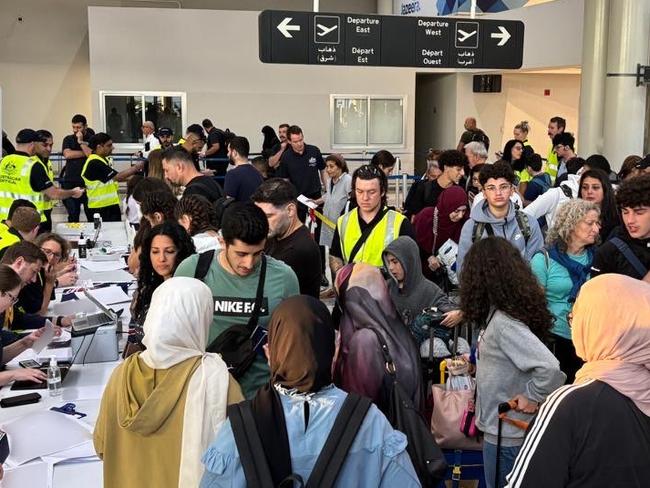 Australian Government officials assisting Australians to depart Lebanon on two government-supported charter flights from Beirut Airport to Larnaca, Cyprus and on to Australia. Picture: NewsWire Handout