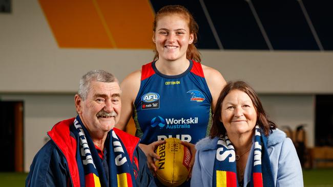 Peter Kauschke, the AFL Fans Association ‘Fan of the Year’, with his wife Tina and Crows AFLW player Amber Ward at West Lakes.