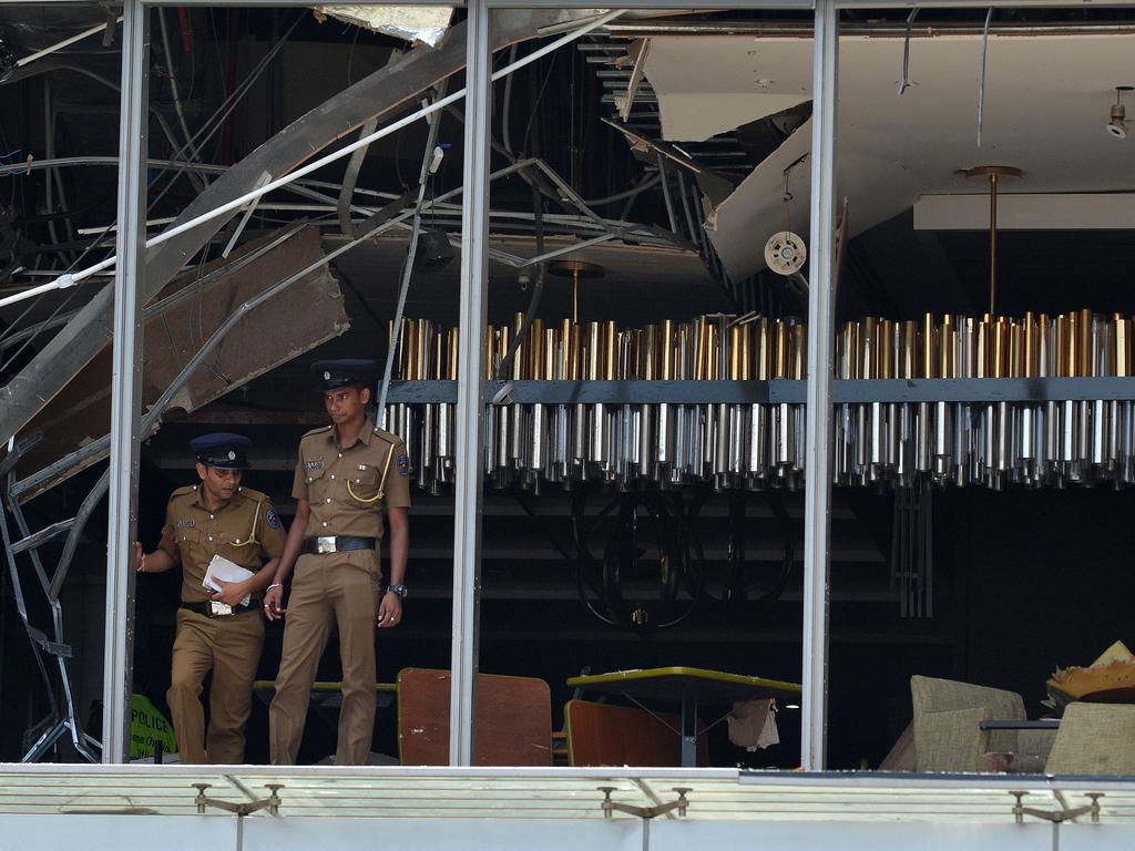 Sri Lankan police stand at the site of an explosion at the luxury Shangri-La Hotel in Colombo. Picture: AFP