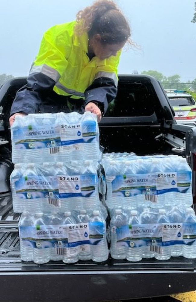 The Townsville Woolworths team delivers supplies to one of Townsville's evacuation centres. Picture: Supplied.