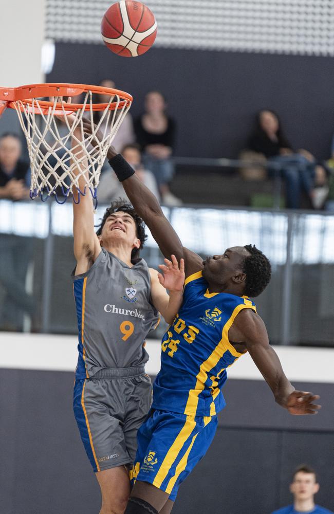 Samuel Geu (right) of Toowoomba Grammar School 1st V defends against Andrew Watene of Churchie 1st V in Round 4 GPS basketball at Toowoomba Grammar School, Saturday, August 3, 2024. Picture: Kevin Farmer