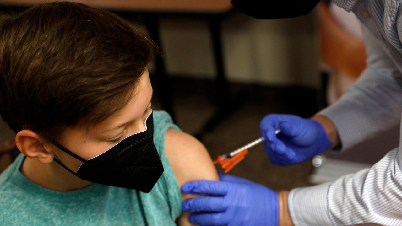 Aiden Arthurs receives the Pfizer-BioNTech Covid-19 Vaccine. A panel of US government advisers recommended authorisation of the vaccine in five-to-11-year-olds. Picture: AFP.