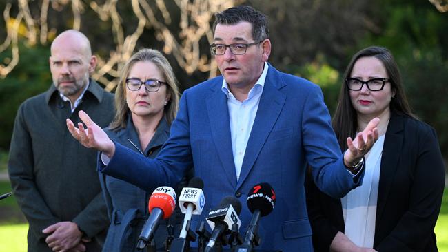 Jeroen Weimar (left) joined Victorian Premier Daniel Andrews as he revealed he had cancelled the Games. Picture: AAP Image/James Ross