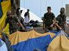 Brazil forces storm ‘terrorist’ camp as Bolsonaro rushed to hospital