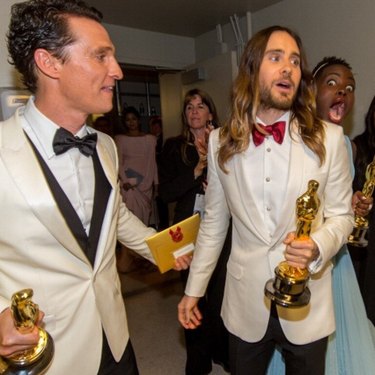 Lupita Nyong’o photobombs Matthew McConaughey and Jared Leto backstage during the Oscars on March 2, 2014 in Hollywood. Picture: Getty