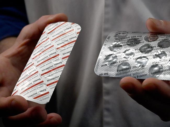 In this file photo taken on February 26, 2020 a medical staffer shows packets of Nivaquine, tablets containing hydroxychloroquine. Picture: Gerard Julien/AFP