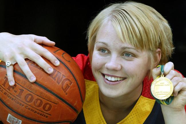 SA basketballer Erin Phillips holding Robert Staunton Medal, 2004.