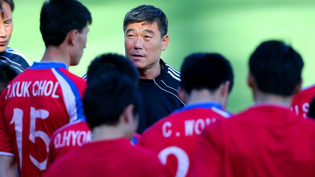 Coach Jo Tong Sop with players. Picture: Richard Dobson